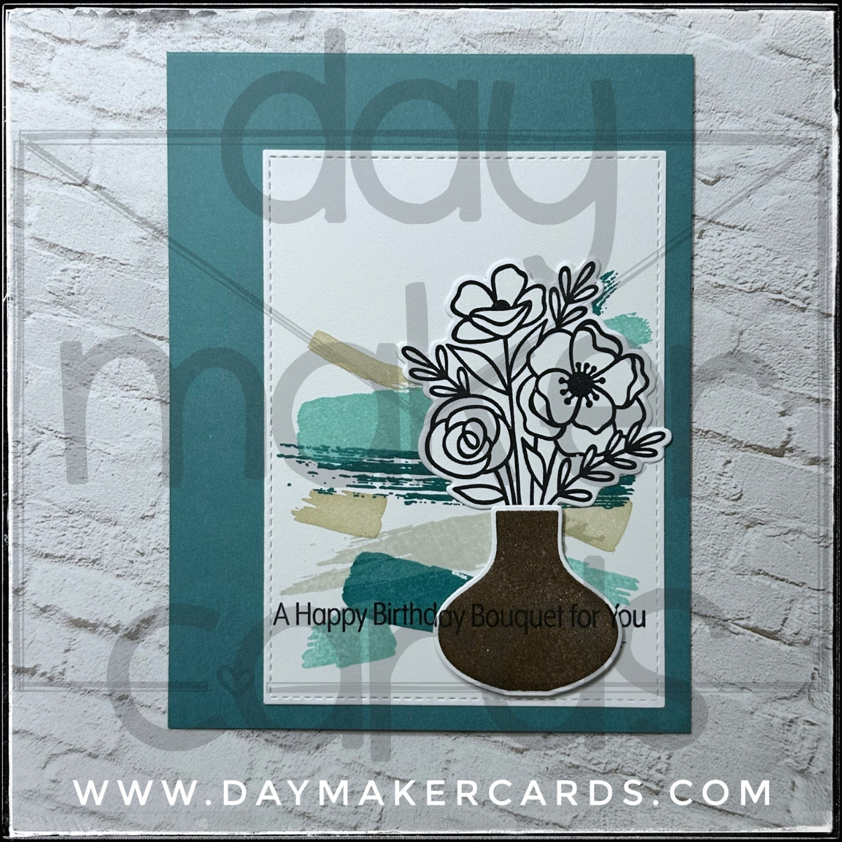 Handmade greeting card with floral design and 'A Happy Birthday Bouquet for You' text, featuring stamped and die-cut images. Includes Day Maker Cards branding, not part of the actual product.