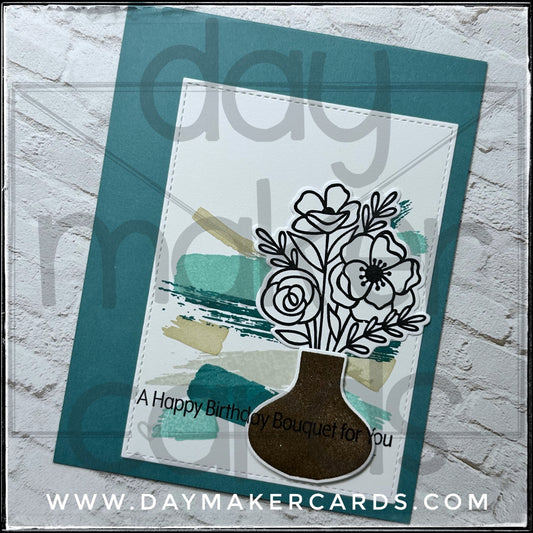 Handmade greeting card with floral design and 'A Happy Birthday Bouquet for You' text, featuring stamped and die-cut images. Includes Day Maker Cards branding, not part of the actual product.