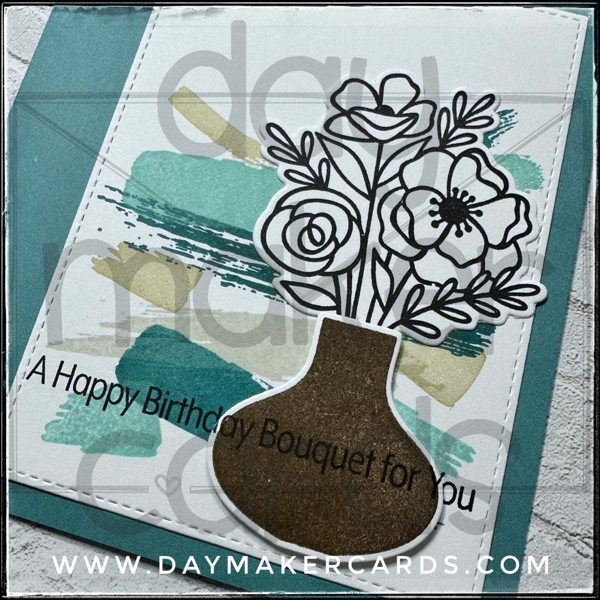Handmade greeting card with floral design and 'A Happy Birthday Bouquet for You' text, featuring stamped and die-cut images. Includes Day Maker Cards branding, not part of the actual product.