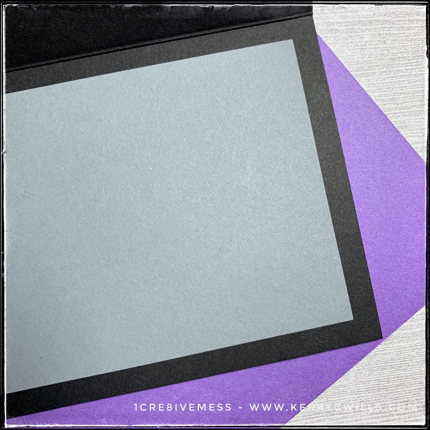 An angled view of the inside of this slimline handmade card. A black card base holds a smaller, grey panel on the inside of the card. This helps to ensure your message to your recipient will be easy to see and easy to read. A thin border surrounds the grey panel so that the black card base is visible when the card is open. Also visible is the purple envelope that's included as well. 