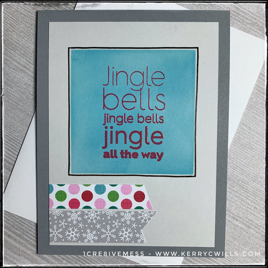 A holiday-inspired handmade card, this dark grey card base is layered with a lighter grey that's been embellished. A turquoise square, centered near the top of the panel has been stenciled in a gorgeous shade of blue. Overlapping it is the sentiment "Jingle bells jingle bells jingle all the way" which has been stamped in red ink and heat embossed with a clear finish. The text is slightly raised off of the card base. There's a beautiful shimmer across the card front and black hand drawn lines nicely outline 